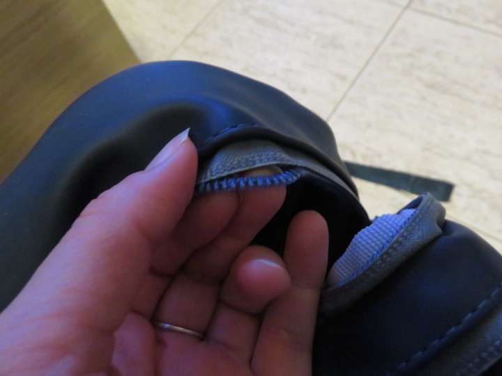 Zipper teeth separating from the fabric of the backpack's zipper